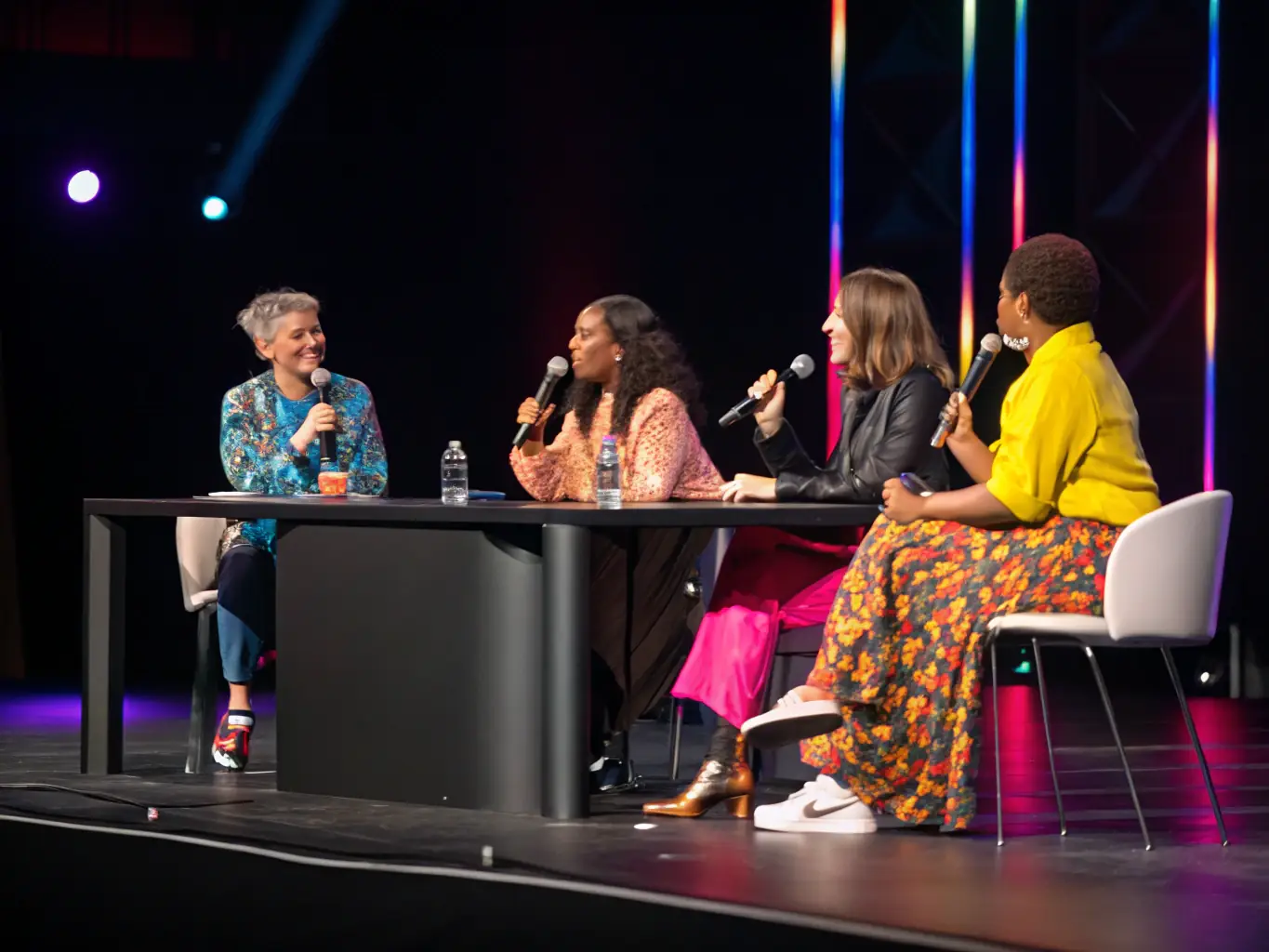 A visually appealing image of a panel discussion at TechSummitUK, featuring diverse experts engaging in a thought-provoking conversation on emerging technologies.